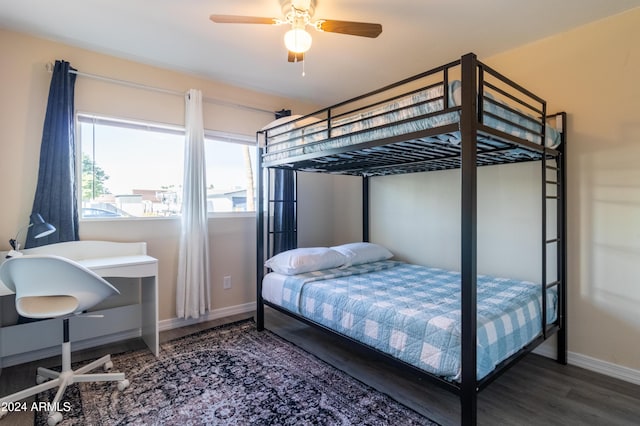 bedroom featuring ceiling fan and dark wood-type flooring