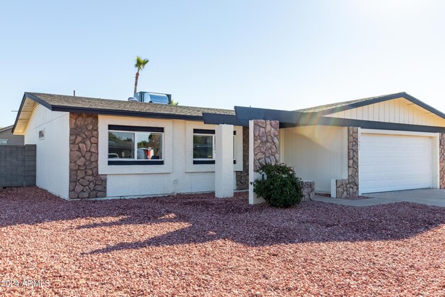 single story home featuring a garage