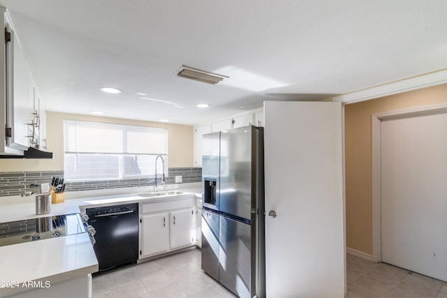 kitchen with sink, stainless steel fridge with ice dispenser, decorative backsplash, black dishwasher, and white cabinetry