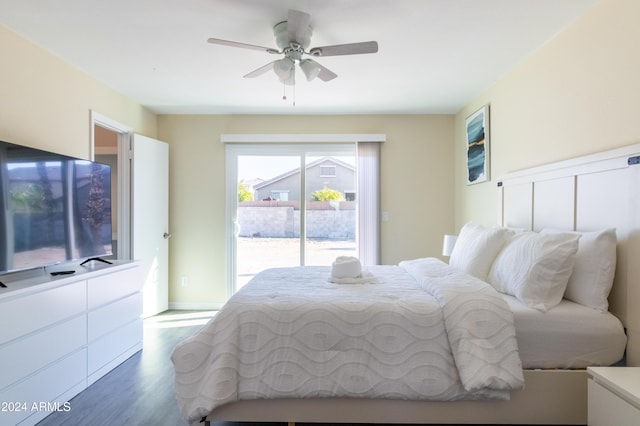 bedroom featuring hardwood / wood-style floors, ceiling fan, and access to exterior