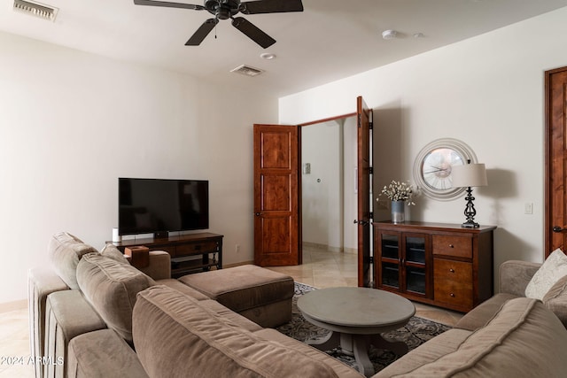 living room with light tile patterned floors and ceiling fan