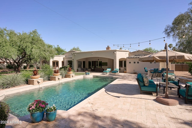 view of swimming pool featuring a patio area