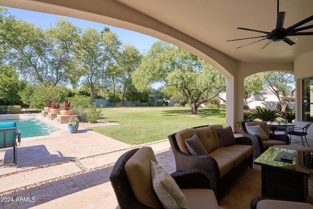 view of patio with ceiling fan and pool water feature