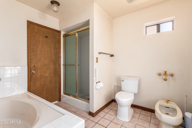 bathroom with toilet, separate shower and tub, a bidet, and tile patterned floors