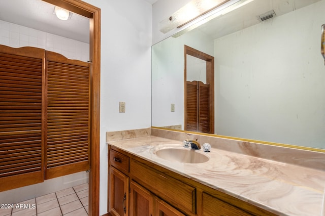 bathroom with vanity and tile patterned floors