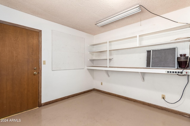 interior space featuring a textured ceiling