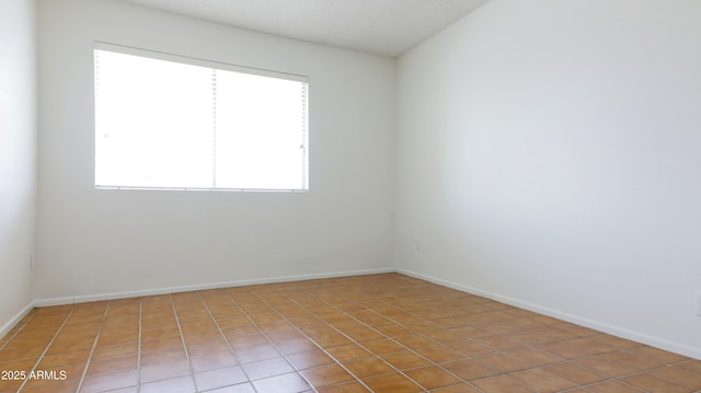 3556 W Augusta Ave, Phoenix, AZ 85051 - empty room featuring light tile patterned floors and baseboards