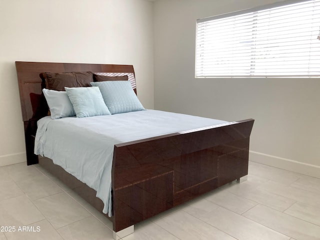 3556 W Augusta Ave, Phoenix, AZ 85051 - bedroom featuring baseboards and light tile patterned floors