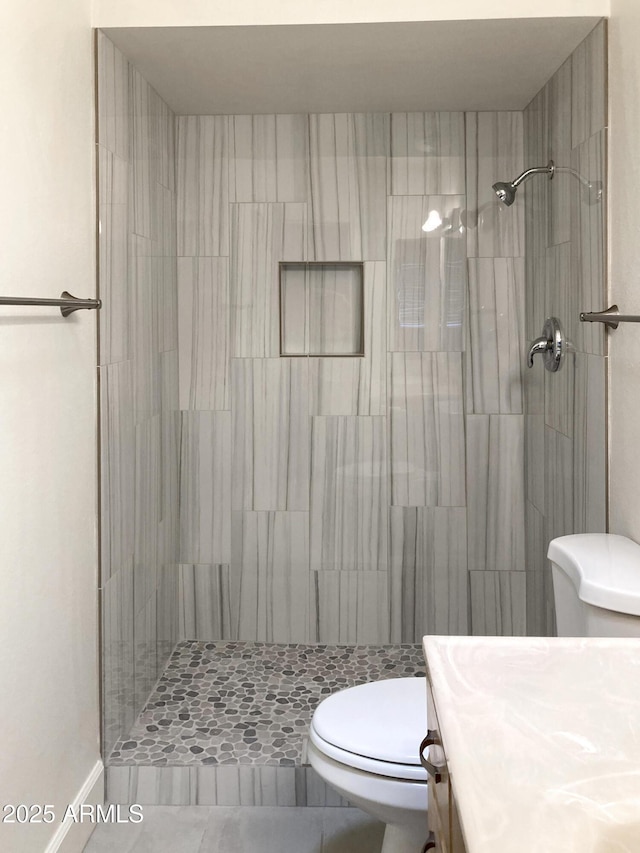 3556 W Augusta Ave, Phoenix, AZ 85051 - full bath featuring toilet, tiled shower, vanity, and tile patterned floors