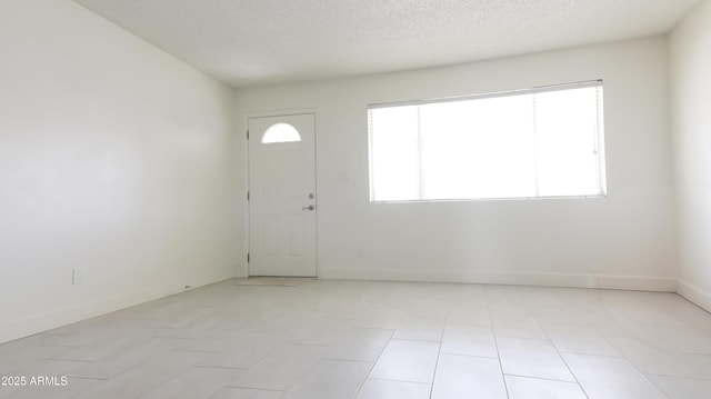 3556 W Augusta Ave, Phoenix, AZ 85051 - foyer featuring baseboards and a textured ceiling