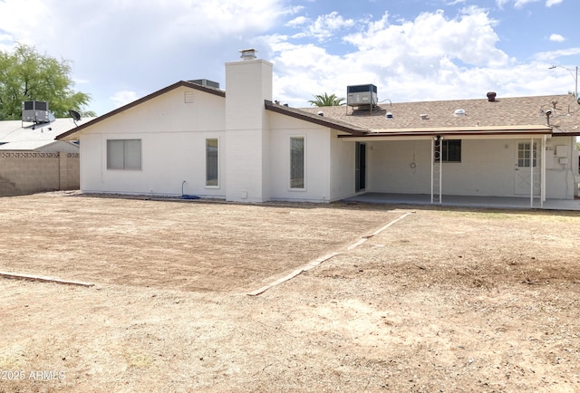 3556 W Augusta Ave, Phoenix, AZ 85051 - back of house with a patio, cooling unit, and a chimney