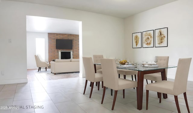 3556 W Augusta Ave, Phoenix, AZ 85051 - dining room featuring a fireplace and light tile patterned flooring