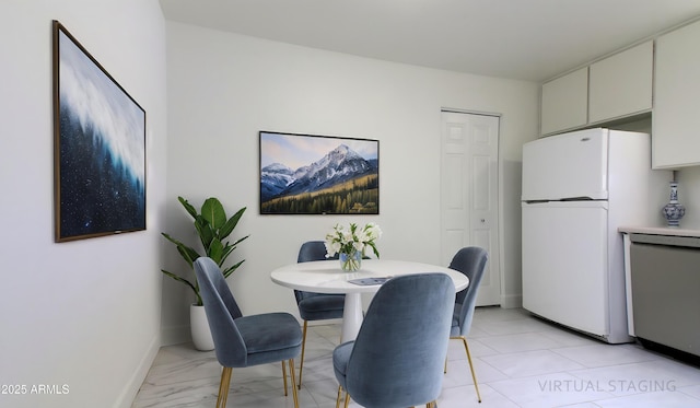3556 W Augusta Ave, Phoenix, AZ 85051 - dining room featuring baseboards