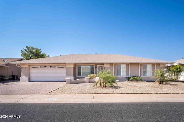 single story home featuring a garage