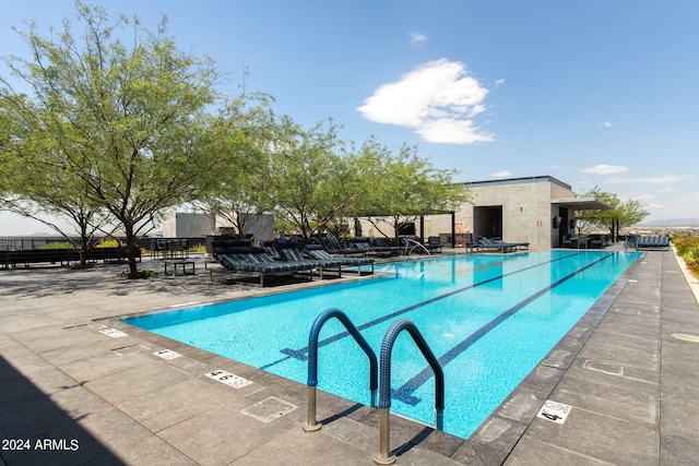 view of swimming pool with a patio area