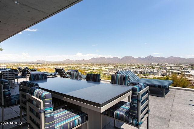 view of patio / terrace featuring a mountain view