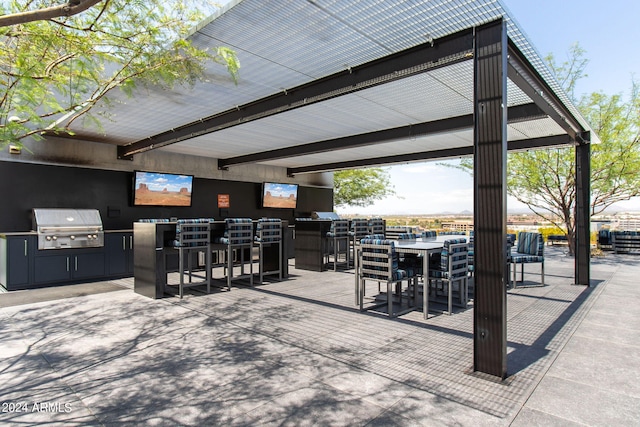 view of patio featuring a bar and grilling area