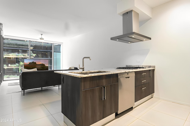 kitchen featuring dark brown cabinetry, sink, stainless steel appliances, island range hood, and light tile patterned flooring