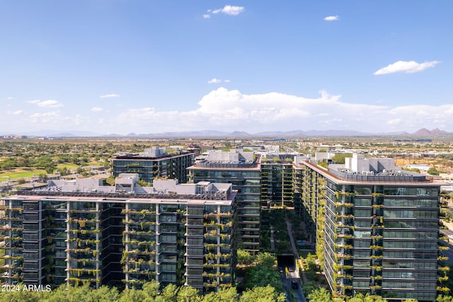 birds eye view of property with a mountain view