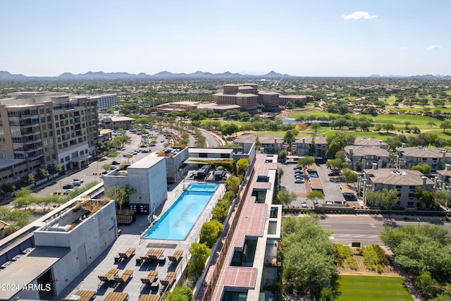 birds eye view of property featuring a mountain view