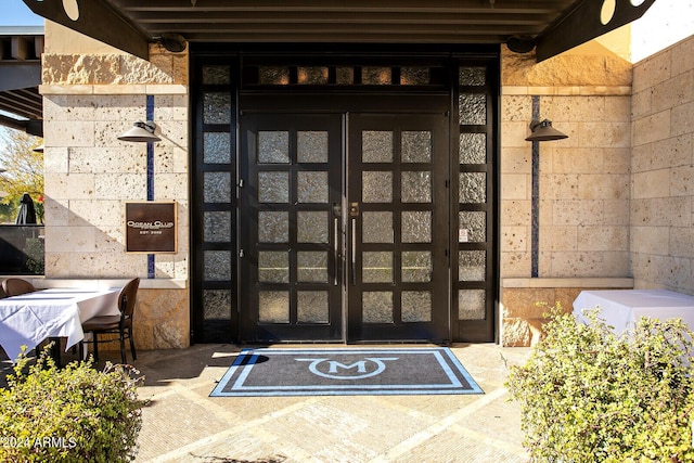 entrance to property featuring french doors