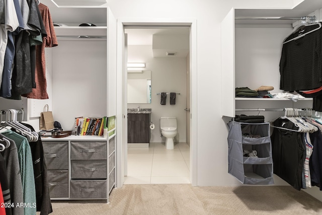 walk in closet featuring light tile patterned floors