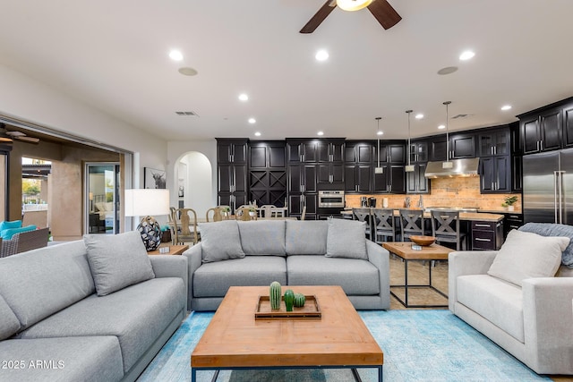 35443 N 87th Pl, Scottsdale, AZ 85266 - living room featuring arched walkways, ceiling fan, and recessed lighting