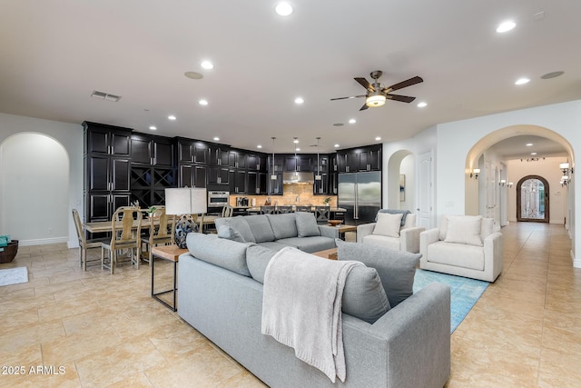 35443 N 87th Pl, Scottsdale, AZ 85266 - living area featuring arched walkways, a ceiling fan, recessed lighting, and baseboards