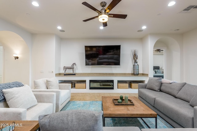 35443 N 87th Pl, Scottsdale, AZ 85266 - tiled living area featuring arched walkways, ceiling fan, and recessed lighting
