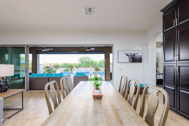 35443 N 87th Pl, Scottsdale, AZ 85266 - dining space with ceiling fan, light tile patterned floors, and arched walkways