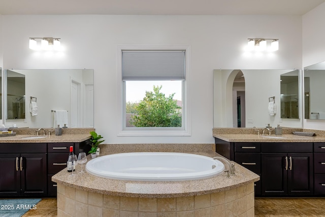 35443 N 87th Pl, Scottsdale, AZ 85266 - bathroom featuring two vanities, a garden tub, and tile patterned flooring
