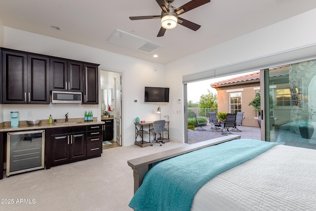 35443 N 87th Pl, Scottsdale, AZ 85266 - bedroom with beverage cooler, light carpet, access to outside, connected bathroom, and recessed lighting