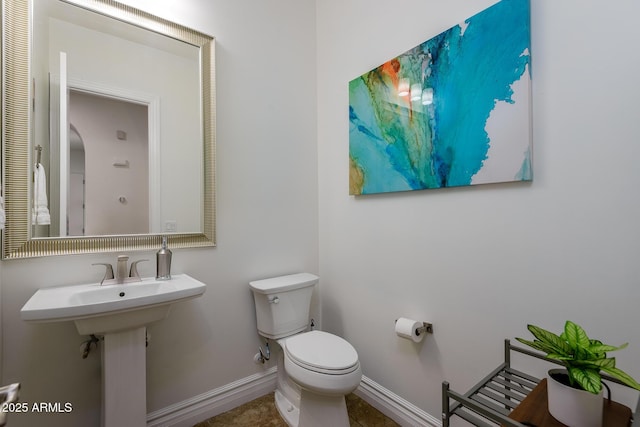 35443 N 87th Pl, Scottsdale, AZ 85266 - half bathroom featuring toilet, baseboards, and tile patterned floors