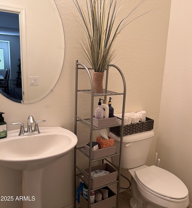 2665 E Gillcrest Rd, Gilbert, AZ 85298 - half bathroom with a sink and toilet