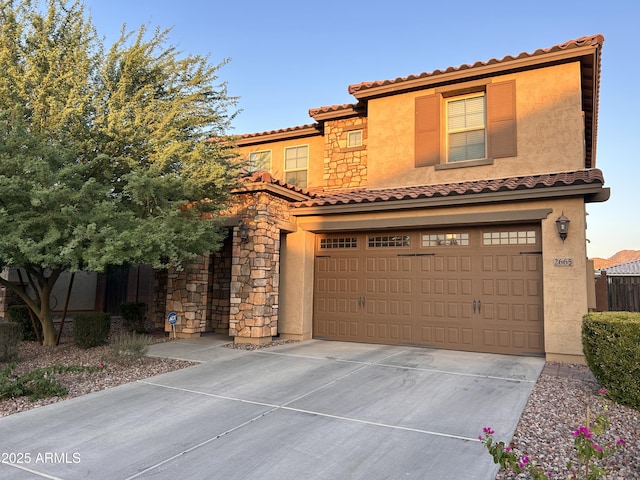 2665 E Gillcrest Rd, Gilbert, AZ 85298 - mediterranean / spanish-style house featuring a tiled roof, an attached garage, driveway, and stucco siding