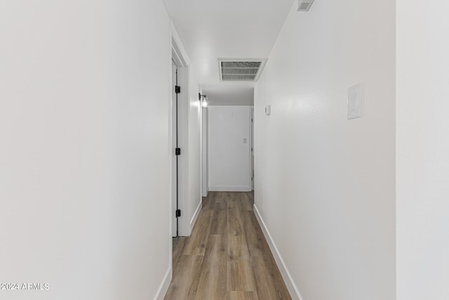 hall with light hardwood / wood-style flooring