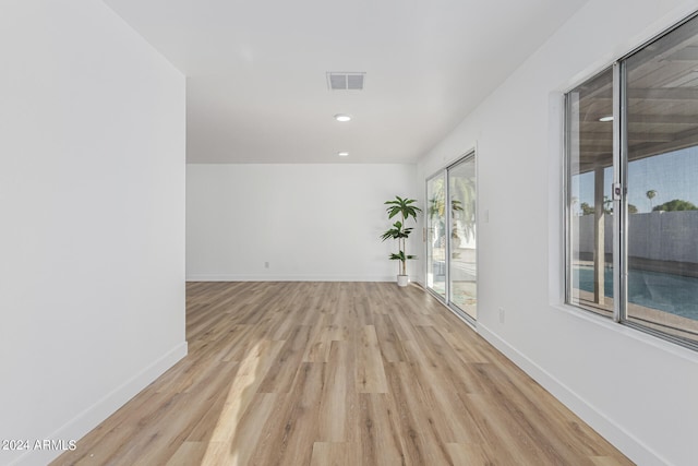 spare room featuring light hardwood / wood-style floors