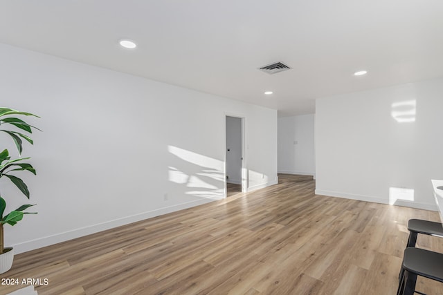 empty room with light hardwood / wood-style floors