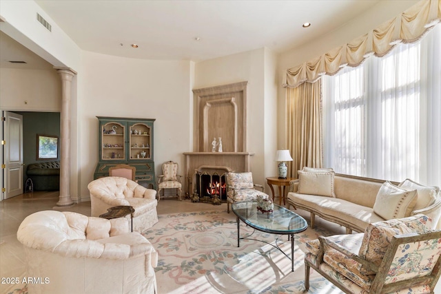 living room featuring ornate columns