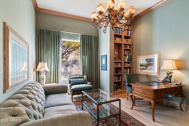 interior space with built in shelves, a notable chandelier, crown molding, and light hardwood / wood-style flooring