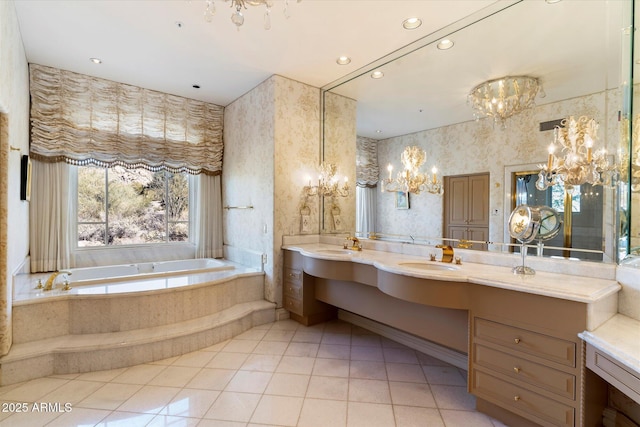 bathroom featuring vanity, tile patterned floors, and a relaxing tiled tub