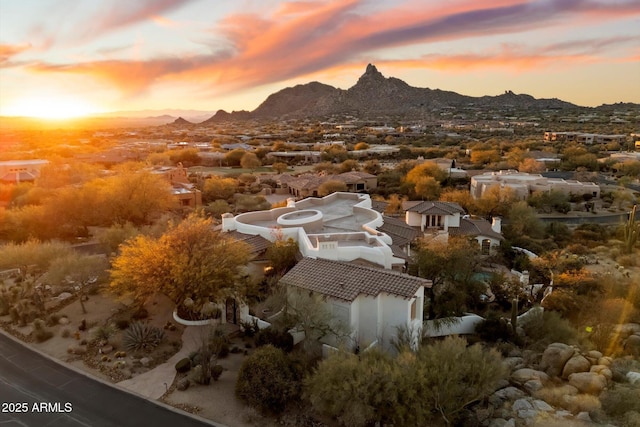 aerial view at dusk with a mountain view