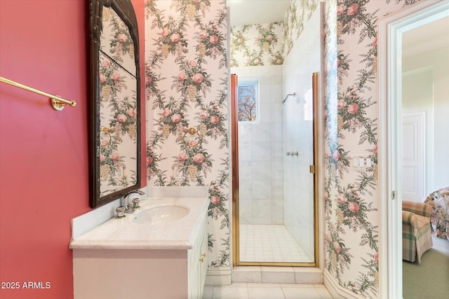 bathroom featuring an enclosed shower, vanity, and tile patterned floors