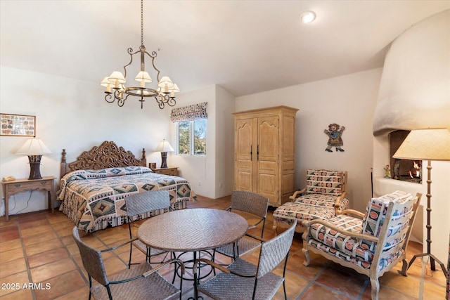 bedroom with a notable chandelier and light tile patterned flooring