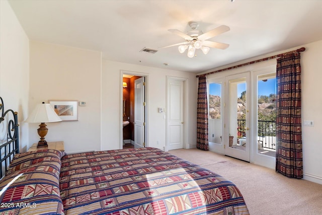 bedroom featuring connected bathroom, ceiling fan, access to exterior, and light colored carpet