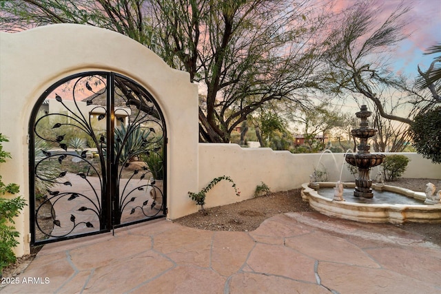 view of patio terrace at dusk