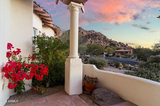 view of patio terrace at dusk