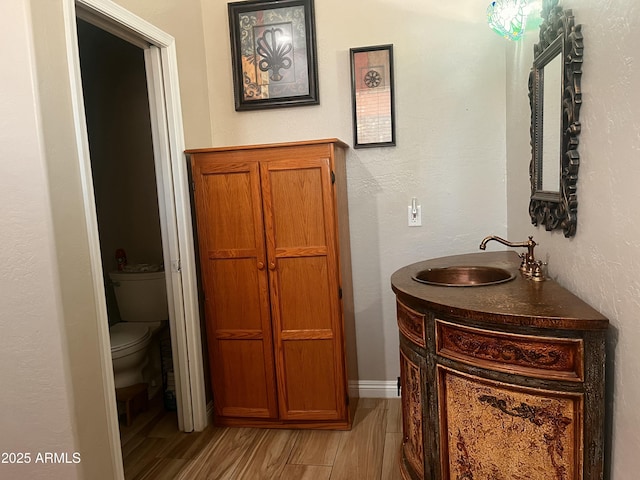 25722 S 179th St, Queen Creek, AZ 85142 - bathroom featuring toilet, vanity, and wood finished floors