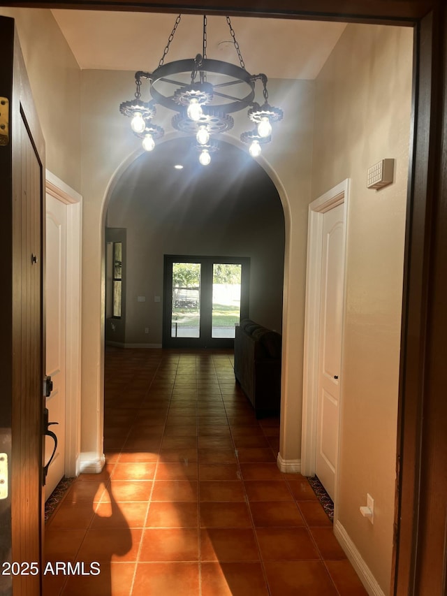 25722 S 179th St, Queen Creek, AZ 85142 - hallway with arched walkways, tile patterned flooring, and baseboards