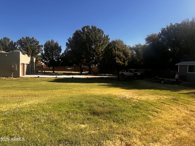 25722 S 179th St, Queen Creek, AZ 85142 - view of green lawn with a garage